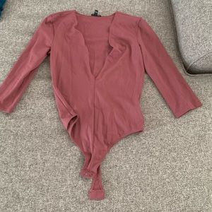 Pink body suit